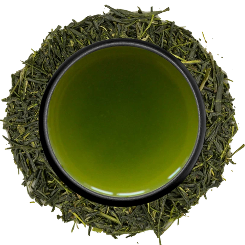 A cup of cloudy deep-green fukamushi sencha seen from above, ringed by finely broken leaves on a white background